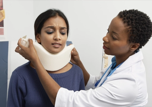 Chiropractic Silver Spring MD Woman Being Fitted With Neck Brace